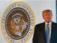  ?? Doug Mills / New York Times ?? Instead of the bald eagle, the altered seal behind President Donald Trump during a speech showed a double-headed eagle clutching golf clubs.