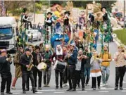  ?? OHAD ZWIGENBERG/AP ?? Performers play music during the Purim parade Monday in Jerusalem, its first in 42 years.