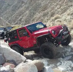  ??  ?? Amy Volmer rides in her Jeep during a recent excursion.