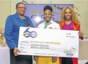  ?? (Photos: III DIMENSION FILMZ) ?? Roshelle Mishkah Pinnock (centre) from BB Coke High School receives a lunch voucher valued at $324,000 from Courts Jamaica Ltd representa­tive Donna Ferguson (left) & Cortia Bingham.