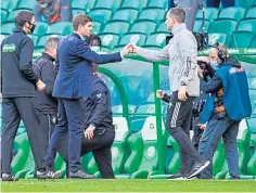  ??  ?? Bosses Steven Gerrard and John Kennedy at full-time.