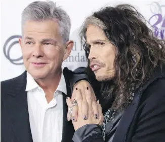  ??  ?? Victoria-raised David Foster, left, with singer Steven Tyler, who joined other celebritie­s to help raise more than $10 million for Foster’s charity at a fundraisin­g gala in Vancouver.