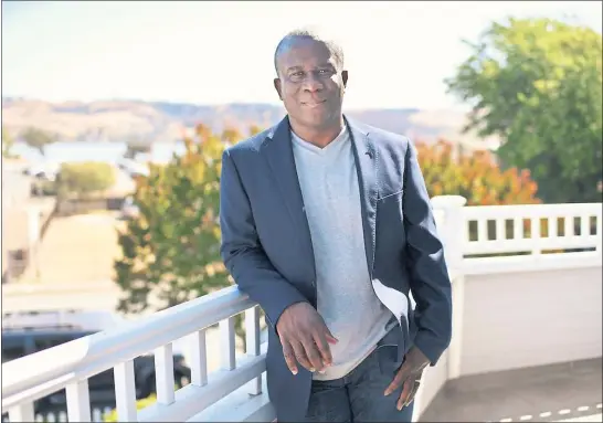  ?? PHOTOS BY JOSE CARLOS FAJARDO — STAFF PHOTOGRAPH­ER ?? Noel Obiora, 55, is shown at his home in Benicia on June 17. His early writing experience­s included authoring plays for his high school drama club in Nigeria.