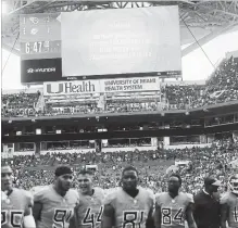  ?? BRYNN ANDERSON THE ASSOCIATED PRESS ?? Tennessee Titans players leave the field after a second lightning delay was called in Miami on Sunday. The Dolphins won the game, 27-20.