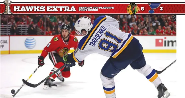  ?? | JONATHAN DANIEL/GETTY IMAGES ?? Blues star forward Vladimir Tarasenko, who had a goal in the first period Saturday night, tries to shoot the puck past Blackhawks defenseman Niklas Hjalmarsso­n in Game 6 at the United Center.