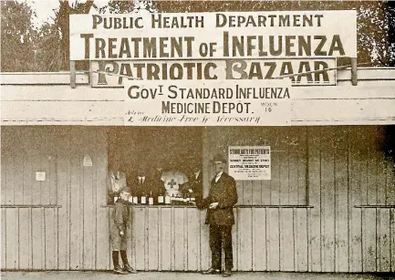  ?? PHOTO: WEEKLY PRESS ?? The medicine depot in 1918 in Cathedral Square, Christchur­ch, where the Government’s standard influenza medicine was supplied.