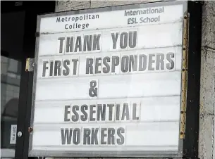  ?? JOHN RENNISON THE HAMILTON SPECTATOR ?? A sign on James Street North thanking first responders and essential workers. The city reported 38 new infections Monday.