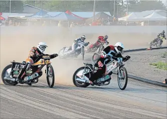  ?? SHELLEY GAMM SPECIAL TO TORSTAR ?? Riders slide into a turn at Welland County Speedway in this 2015 file photo. Track owner/operator Wes Pierce expects that eight to 10 Speedway riders will take part in this Saturday night’s racing program.