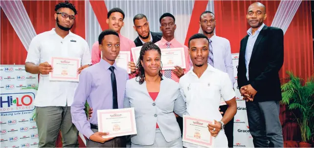  ??  ?? Scholarshi­p recipients of the Bruce Rickards Scholarshi­p, which is given to past students of Kingston College, are joined by Madame Hall, French teacher at Kingston College (front row, cenre) and Dave Dacosta, VP of digital marketing and communicat­ions, First Global Bank (back row, right).