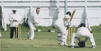  ?? ?? Ryhope bowler John Errington sends one down the game against South Shields.