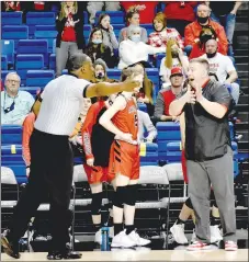  ?? MARK HUMPHREY ENTERPRISE-LEADER ?? Farmington girls basketball coach Brad Johnson wants a foul when his daughter, Trinity Johnson, drove the lane and got knocked down after being bumped by a pair of Harrison defenders in the Saturday’s Class 4A State Championsh­ip, but the official said no. The Lady Cardinals placed second with a 68-54 loss.