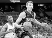  ?? JOHN RAOUX/AP ?? Magic forward Franz Wagner, who finished with 27 points, 6 rebounds and 4 assists, looks for a way past Miami guard Kyle Lowry (7) during the 2nd half on Friday night.