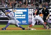  ?? NICK WASS/ASSOCIATED PRESS FILE PHOTO ?? The Nationals’ Adam Eaton injured himself in April during a play at first base against the Mets in Washington. Eaton is out for the rest of the season with a torn anterior cruciate ligament in his left knee.