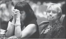  ?? JULIE JACOBSON/ AP ?? Mitt Romney campaign volunteer Lynn Short, right, and a supporter who did not want to be identified, watch election returns at a GOP watch party, Tuesday in Las Vegas.