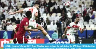  ?? AFP ?? LUSAIL: Lebanon’s forward #11 Omar Chaaban leaps to head the ball during the AFC Qatar 2023 Asian Cup Group A football match between Qatar and Lebanon at the Lusail Stadium in Lusail. –