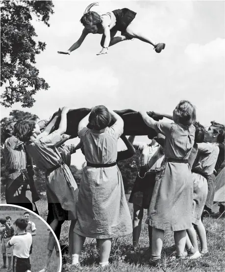  ??  ?? Girl power: In 1955, Guides at camp throw one of their number in the air on a blanket. Did anyone complete a council risk assessment, though?