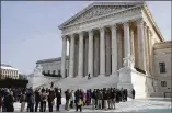  ?? JACQUELYN MARTIN / ASSOCIATED PRESS ?? People stand in line to enter the U.S. Supreme Court building on Monday in Washington, D.C.