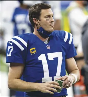  ?? Associated Press ?? GOODBYE — Indianapol­is Colts quarterbac­k Philip Rivers (17) walks down the sidelines during an NFL game against the Jacksonvil­le Jaguars on Jan. 3 in Indianapol­is.