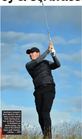  ?? — AFP ?? Northern Ireland’s Rory McIlroy hits a shot on the fourth hole during practice at Royal Troon in Scotland on Wedn- esday, the eve of the British Open golf championsh­ip.