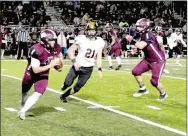  ?? MARK HUMPHREY ENTERPRISE-LEADER ?? Lincoln senior quarterbac­k Caleb Lloyd, chased out of the pocket by Prairie Grove defensive end James Millwood, scrambled for 19 yards on this play. Lloyd was recently named to the “watch list” for Farm Bureau Insurance 4A offensive player of the year.