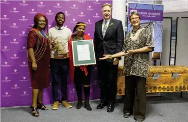  ?? Photo: Emily Stander ?? Winners in the RU institute/department/section category, the Centre for Social Developmen­t - represente­d by Ruth Nombewu (L), Kennedy Msimango and Vatiswa Joni (holding framed certificat­e).