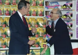  ?? AP PHOTO ?? In this Jan. 7, 1992, file photo, President George H. Bush (left), listens to Toys R Us Chairman Charles Lazarus (right), as he visits the toy chain’s second store to open in Japan. Lazarus, the World War II veteran who founded Toy R Us, has died at...