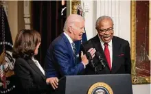  ?? Desiree Rios/New York Times ?? President Joe Biden speaks with the Rev. Wheeler Parker Jr. before he signs a proclamati­on Tuesday to establish the Emmett Till and Mamie Till-Mobley National Monument.