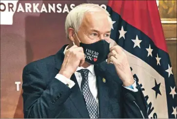  ?? Staci Vandagriff Arkansas Democrat-Gazette ?? ARKANSAS Gov. Asa Hutchinson, a Republican, vetoed legislatio­n to make his state the first to ban genderconf­irming treatments or surgery for transgende­r youths. The GOP-led Legislatur­e overrode his veto.