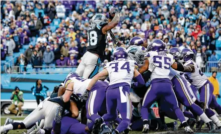  ?? STREETER LECKA / GETTY IMAGES ?? Jonathan Stewart scores from 1 yard out with 1:47 left Sunday to give the Panthers a 31-24 victory over the Vikings in Charlotte, N.C. Stewart scored three times , including the game’s first touchdown on a 60-yard burst.