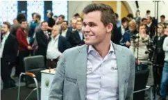  ?? FOTO: NTB SCANPIX ?? Magnus Carlsen kunne smile etter å ha blitt verdensmes­ter i lynsjakk – igjen.