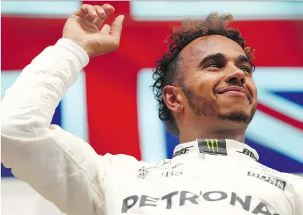  ?? GETTY IMAGES ?? British driver Lewis Hamilton can break Michael Schumacher’s record for Formula One pole positions at this weekend’s Italian Grand Prix. But while setting the record would be nice, he said, “the ultimate goal is to win, to put a dent in that lead that...