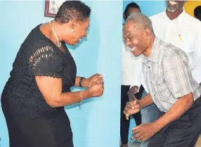  ?? FILE. ?? In this file photo from Wednesday, October 6, 2017, former Jamaica boxing champion George ‘Bunny’ Grant shows Sports Minister Olivia Grange, a thing or two from his days in the ring. Grange was on a tour of his then newly refurbishe­d home on Weymouth Drive