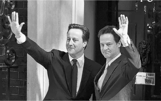  ?? Carl Court / AFP / Gett
y Imag
es ?? British Prime Minister David Cameron, left, and Deputy Prime Minister Nick Clegg.
