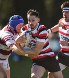  ??  ?? Ivan Jacob of Enniscorth­y RFC is tackled by Tullow’s Frank Murphy.