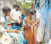  ?? AFP ?? A health worker inoculates a resident with a dose of the Covaxin during a door-to-door drive at a slum in Chennai on Monday.