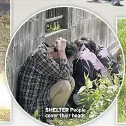  ??  ?? SHELTER People cover their heads
