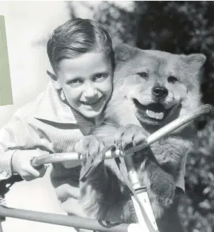  ?? WITH DADS AND brothers serving in the war, many children rely on pets as play pals in the 1940s. ??