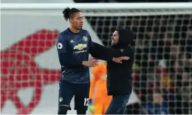  ??  ?? Chris Smalling was approached on the pitch by a supporter shortly after Arsenal had scored to make it 2-0. Photograph: James Williamson - AMA/Getty Images