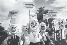  ?? ?? Anti-Semitism unmasked: Protesters dressed as Yahya Sinwar, Hamas chief in the Gaza Strip, denounce the UN Human Rights Council’s Pillay report on Israel.