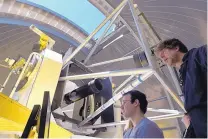  ??  ?? New Mexico Tech intern Jacob Schirer, left, and research scientist William Ryan work with the 2.4-meter telescope at the Magdalena Ridge Observator­y on South Baldy peak, southwest of Socorro. The telescope tracks asteroids that might pose a threat to...