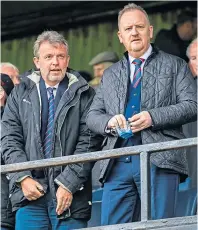  ??  ?? Caley Thistle chairman Ross Morrison, left, and chief executive Scot Gardiner co-signed the club statement