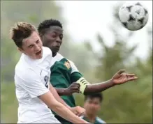  ?? MATHEW MCCARTHY, RECORD STAFF ?? Spencer Bartels, left, of Bluevale and Cameron Heights’ Maja Lukambo collide while going for a header during the WCSSAA boys’ soccer final at RIM Park on Thursday. Cameron Heights won, 3-0.