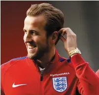  ??  ?? England will hope that Harry Kane is still smiling after captaining them in their World Cup qualifier against Scotland this evening