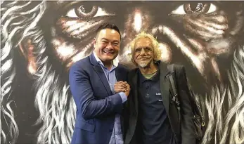  ??  ?? Associate Professor Kelvin Kong with Riverbank Frank standing in front of the Aboriginal man mural. PHOTO: SUPPLIED