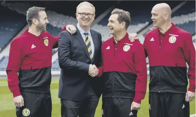  ??  ?? 0 Scotland manager Alex Mcleish with his backroom staff: James Mcfadden, left, Peter Grant and Stevie Woods, right, after yesterday’s squad announceme­nt at Hampden.