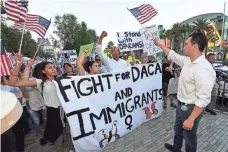  ?? ETHAN MILLER, GETTY IMAGES ?? Rep. Ruben Kihuen, D-Nev., leads immigrants and supporters as they march Sunday on the Las Vegas Strip.