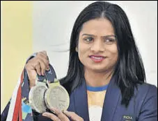  ?? REUTERS ?? Swapna Barman (left) got ~10 lakh from Bengal while Dutee Chand was given a special amount of ~3 crore for her two silver medals.