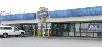  ??  ?? A Blockbuste­r Video store May 2 in Anchorage, Alaska. The last two Blockbuste­r Video stores in Alaska will rent their last video on Sunday, apparently leaving the last Blockbuste­r Video in Bend, Ore.