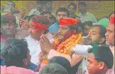  ?? HT ?? ▪ SP candidate Nagendra Singh Patel after winning the bypolls outside Mundera Mandi premises on Wednesday evening.