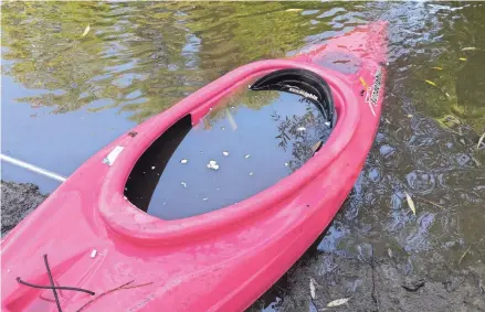  ?? LORI NICKEL / JOURNAL SENTINEL ?? Unfortunat­ely, Lori Nickel's kayak took on water throughout the race - and sank.